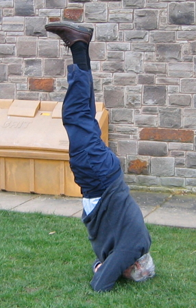 Guy doing a headstand